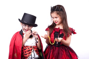 a boy and a girl vampire witch on a white background