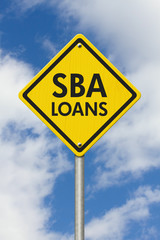 SBA Loans yellow warning highway road sign