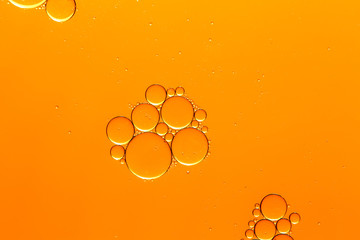 Abstract orange fluid with bubbles.