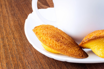 Homemade vanilla cookies Madeleine with a cup of tea 