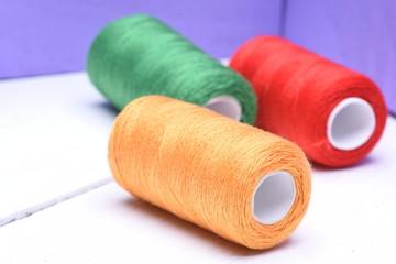 Colorful spools of thread closeup