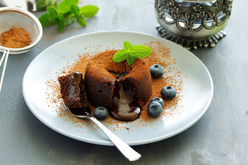 Fondant- delicious chocolate dessert with blueberries.