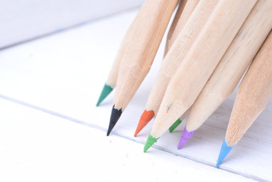 Group of sharp wooden crayons closeup