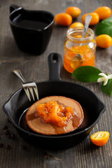 Chocolate pancakes with orange marmalade.