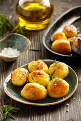 Baked potatoes with rosemary.