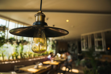 Lamps with Edison in the interior of a modern cafe.