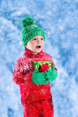 Kids holding Christmas presents