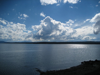 calm lake yellowstone reflection clouds