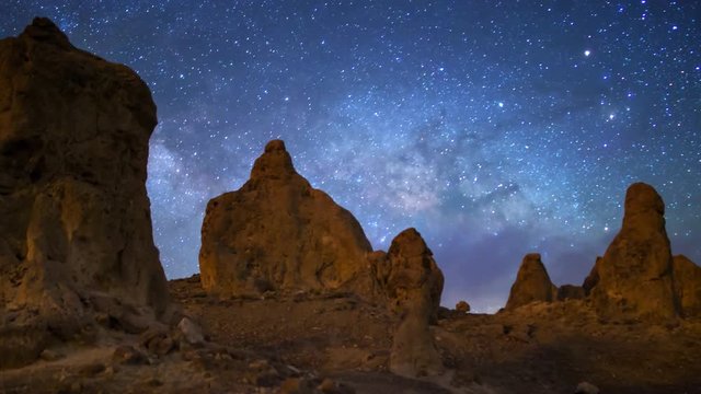 Motion controlled astrophotography time lapse with dolly pull tracking motion of Milky Way galaxy rising over tufas at Trona Pinnacles, California -Long Shot-