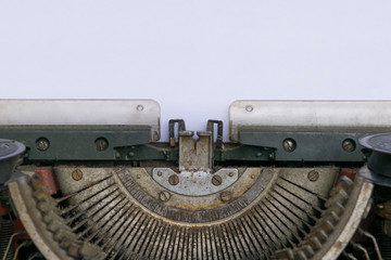 Fototapeta na wymiar Typewriter and empty white paper