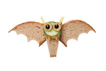 Halloween bat made of bread on white background