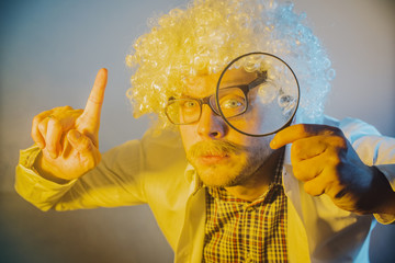 funny scientist, like Einstein with a magnifying glass