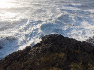 Raging storm waves smashing into rocks