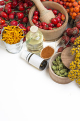 Medicinal plants and herbs composition: Dog rose, bunch branch Rosehips, types Rosa canina hips, essential oil. bunch, Tea with rosehip, Tansy, Anise, dried flowers of linden and chamomile on white 