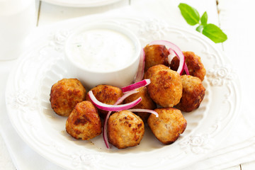 Homemade meatballs with cream sauce.