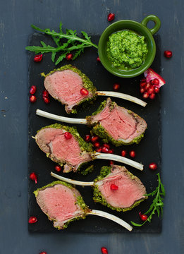 Rack of lamb in herb cheese and breadcrumbs. A festive meal. Selective focus.