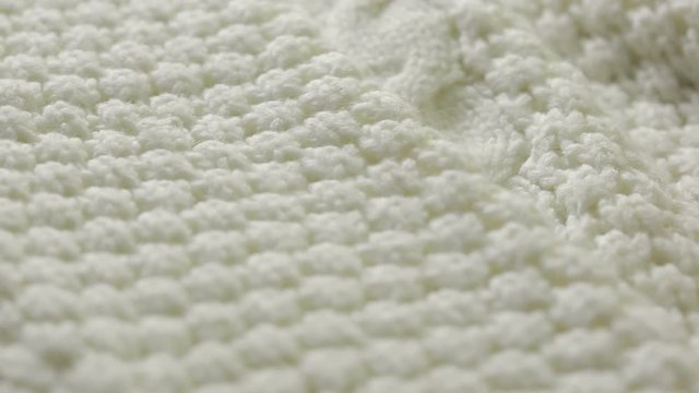 white knitted wool texture. use as background. close-up