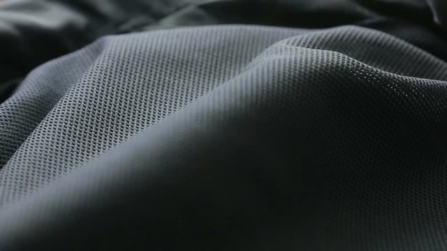 mesh cloth. black synthetic fabric. can be used as a background