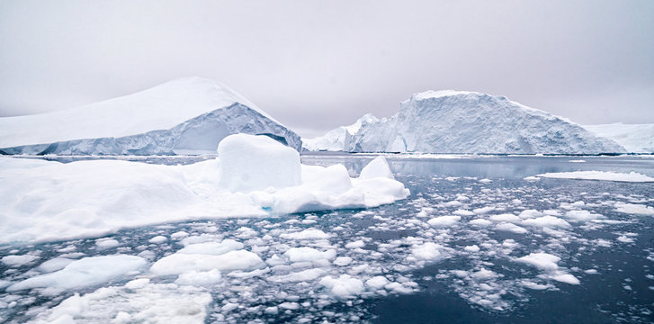 Beautiful icebergs are on arctic ocean in icefjord
