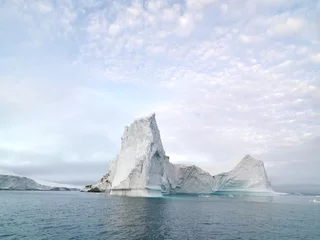 Fotobehang Beautiful icebergs are on arctic ocean in icefjord © murattellioglu