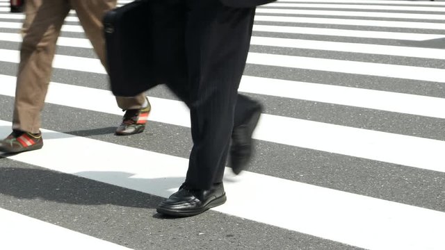 Tokyo - People walking on crosswalk. Close up of feet. Shinjuku 2016. 4K resolution 