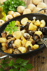 Fried potatoes with mushrooms