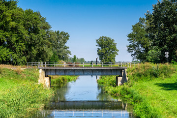 Countryside landscape railroad steel bridge over water canal