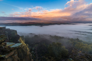 Scenic View From the Top of Hill with Morning Mist and Colourful Sunrise Clouds