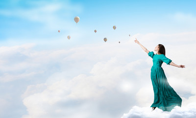 Fototapeta na wymiar Woman levitating in sky . Mixed media