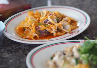 Stir fried squid with salty egg yolk and onion