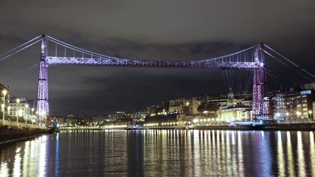 Bizkaia Bridge at night, Biscay, Basque Country, Spain. Time lapse of the Hanging bridge, made in 1893, Unesco world heritage site.