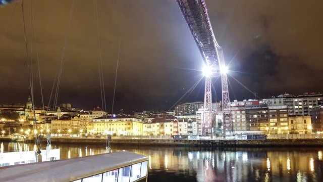 Bizkaia Bridge at night, Biscay, Basque Country, Spain. Time lapse of the Hanging bridge, made in 1893, Unesco world heritage site.