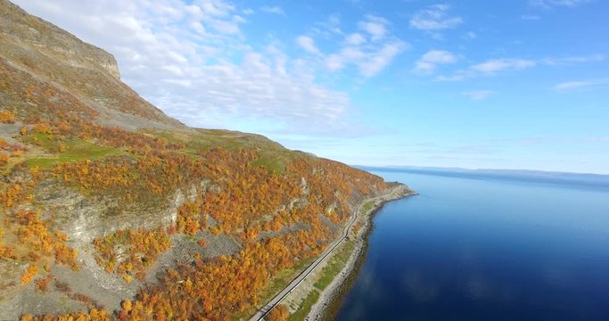 Road and autumn colors on a mountain, in Oldersfjord near Nordkapp, in Finnmark, Norway