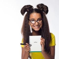 Emotional young brunette girl with long hair in yellow t-shirt with the glasses on a white...