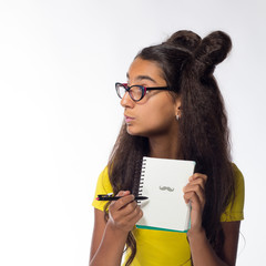 Emotional young brunette girl with long hair in yellow t-shirt with the glasses on a white...