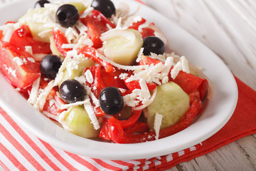 Shopska salad from fresh vegetables with feta cheese close-up. Horizontal