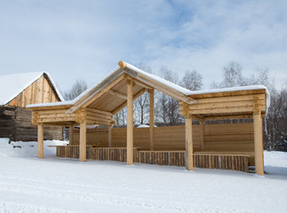 Fototapeta na wymiar winter view at traditional siberian wooden house