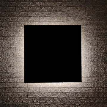 Black sign and Lighting design on modern brick wall.
