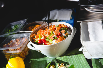 Vegetable salad in big white bawl stands on a table