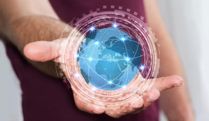 Businessman using digital tactile world interface with his hand