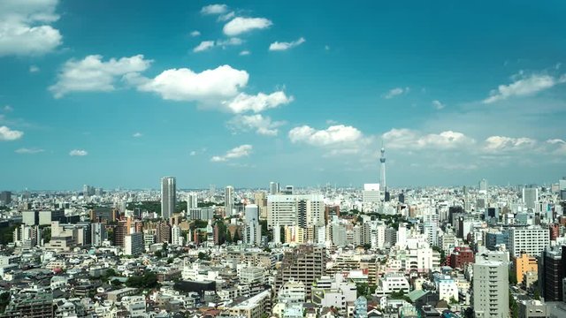 Tokyo - Aerial view of city with Skytree and clouds on blue sky. 4K resolution time lapse. 2016