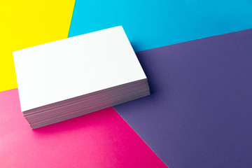 Business card blank over colorful abstract background.