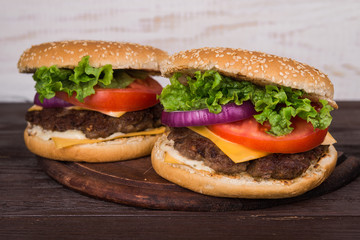 burgers on wooden table