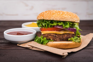 burgers on wooden table