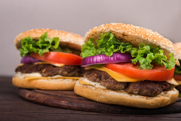 burgers on wooden table