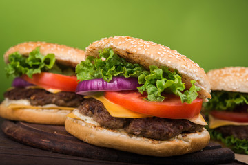 burgers on wooden table