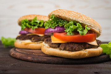 burgers on wooden table