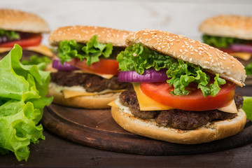 burgers on wooden table