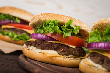 burgers on wooden table