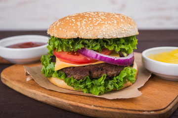 burgers on wooden table